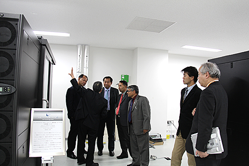 Facility Tour (in front of one of the supercomputing system [C])